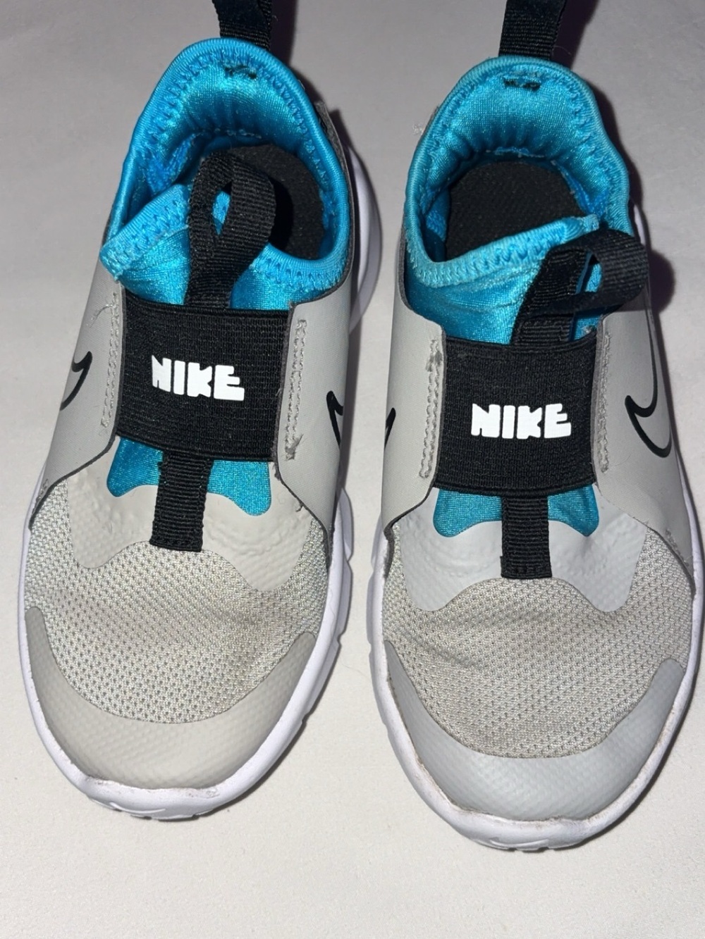 Nike Kids Slip-On Sneakers in Gray and Bright Blue